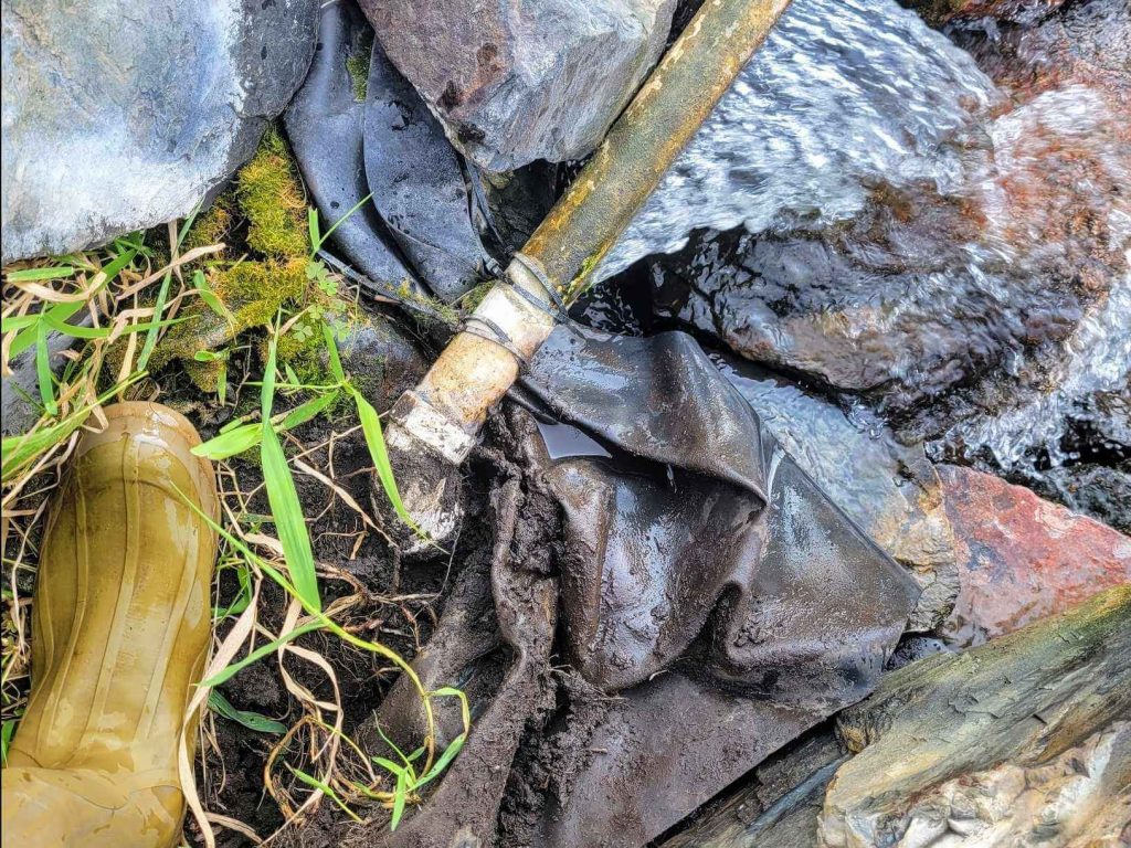 pond leak found during exploratory drain and clean in Minnesota